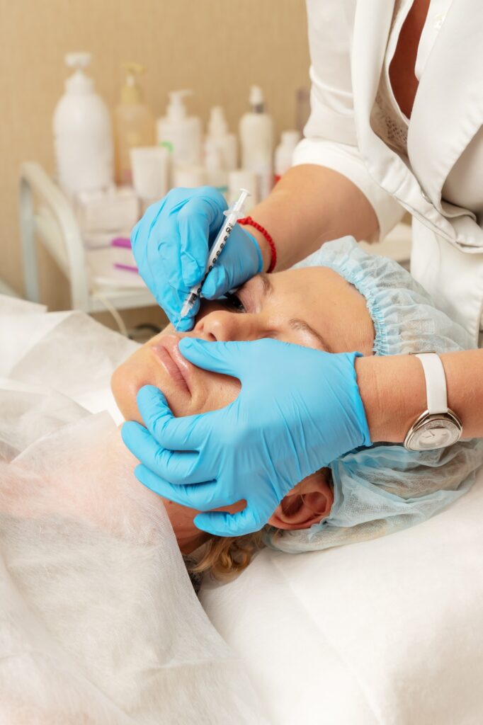 Beauty injections in spa medicine cabinet. Woman’s health. A cosmetologist making beauty treatment